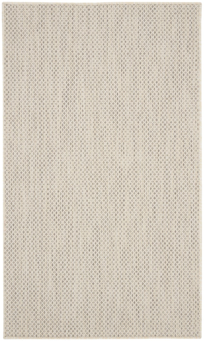 Beige woven rug with a subtle diamond pattern and textured surface; versatile neutral decor.
