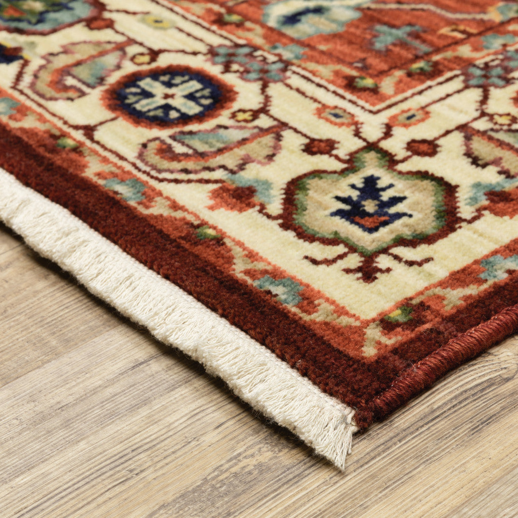 2' X 3' Red Ivory Orange And Blue Oriental Power Loom Stain Resistant Area Rug With Fringe