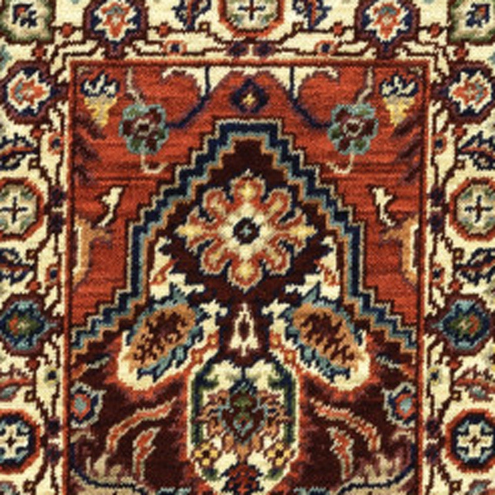 2' X 6' Red Ivory Orange And Blue Oriental Power Loom Stain Resistant Runner Rug With Fringe