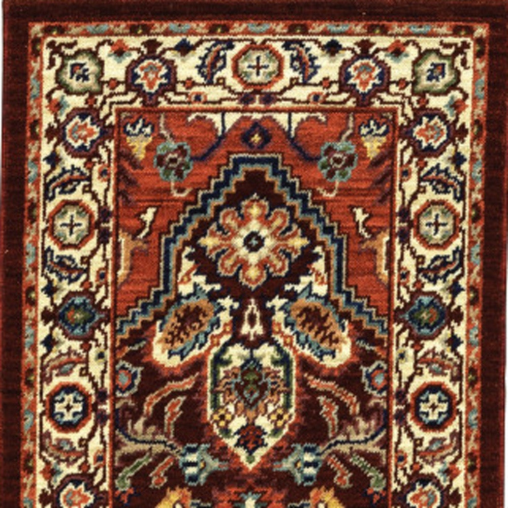 2' X 6' Red Ivory Orange And Blue Oriental Power Loom Stain Resistant Runner Rug With Fringe