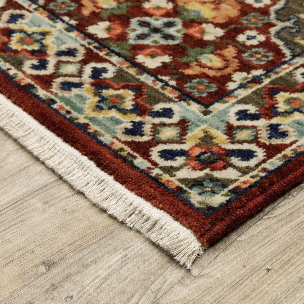 5' X 8' Red Rust Navy Light Blue Brown Orange Ivory And Gold Oriental Power Loom Stain Resistant Area Rug With Fringe