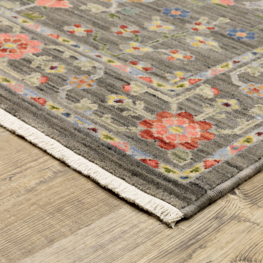 3' X 5' Grey Salmon Pink Gold Blue Rust Deep Blue Ivory And Green Oriental Power Loom Stain Resistant Area Rug With Fringe