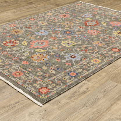 6' X 9' Grey Salmon Pink Gold Blue Rust Deep Blue Ivory And Green Oriental Power Loom Stain Resistant Area Rug With Fringe