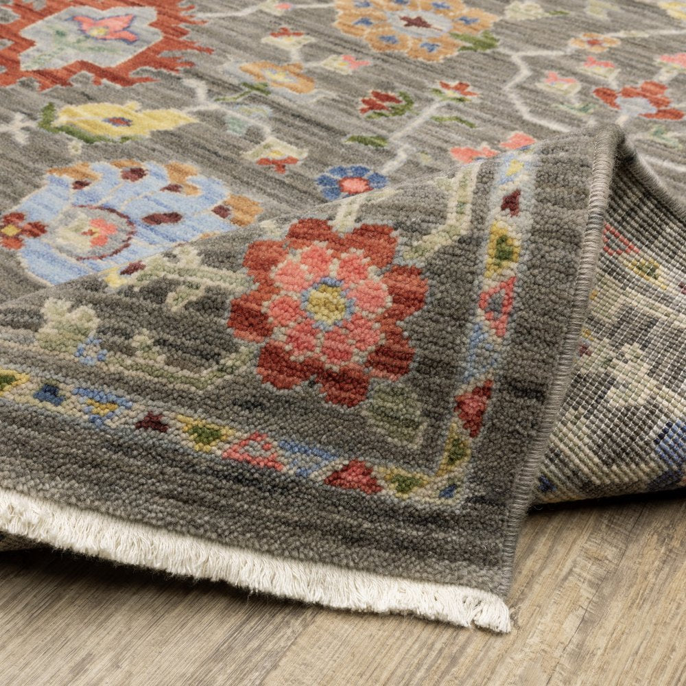 6' X 9' Grey Salmon Pink Gold Blue Rust Deep Blue Ivory And Green Oriental Power Loom Stain Resistant Area Rug With Fringe