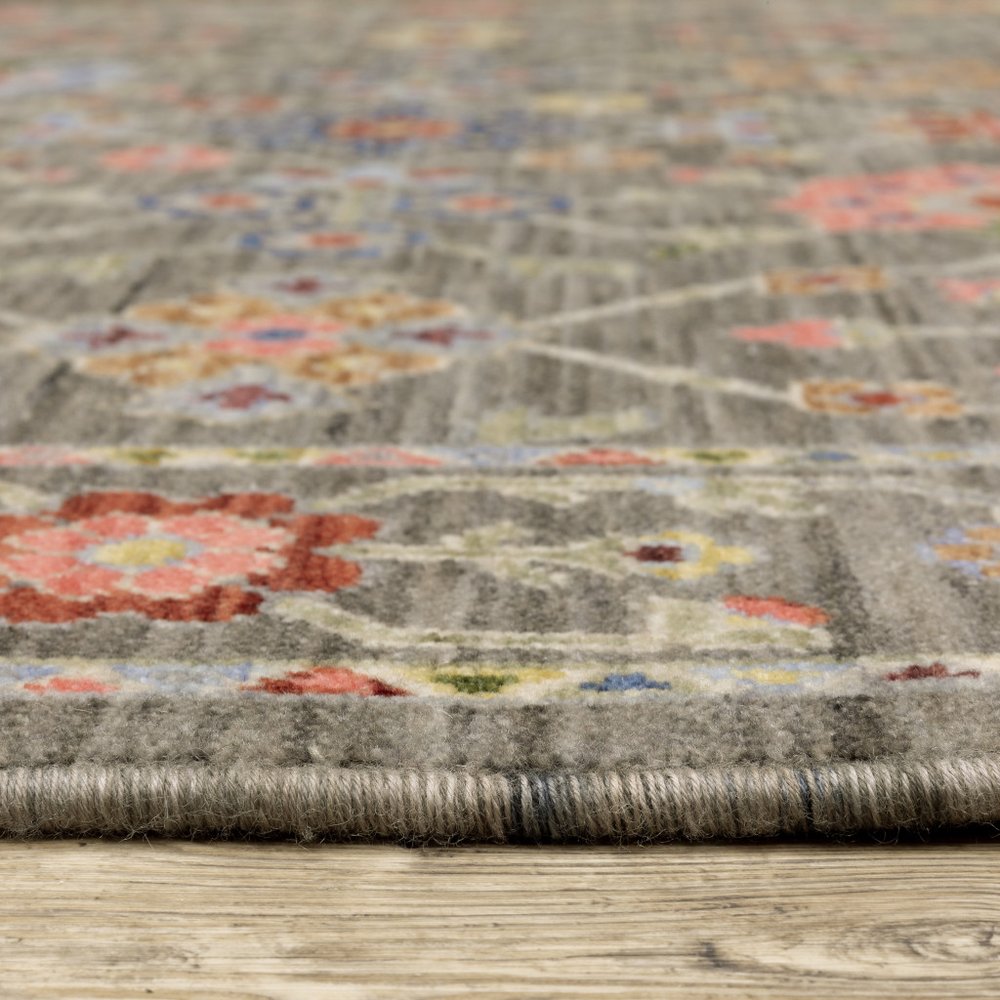 10' X 13' Grey Salmon Pink Gold Blue Rust Deep Blue Ivory And Green Oriental Power Loom Stain Resistant Area Rug With Fringe