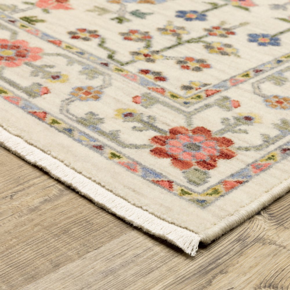 10' X 13' Ivory Salmon Pink Gold Blues Grey Rust And Green Oriental Power Loom Stain Resistant Area Rug With Fringe