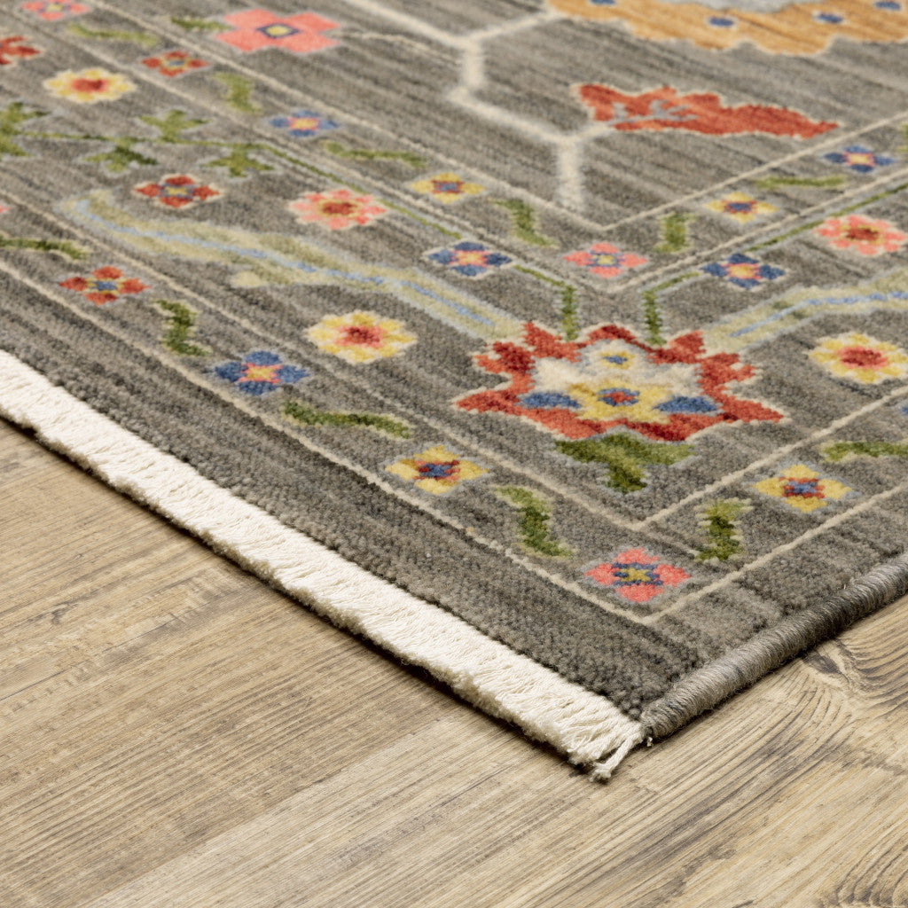 6' X 9' Grey Blue Pink Orange Rust Red Green And Ivory Oriental Power Loom Stain Resistant Area Rug With Fringe