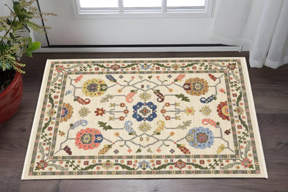 3' X 5' Ivory Green Blues Pink Yellow Rust Brown Tan And Grey Oriental Power Loom Stain Resistant Area Rug With Fringe