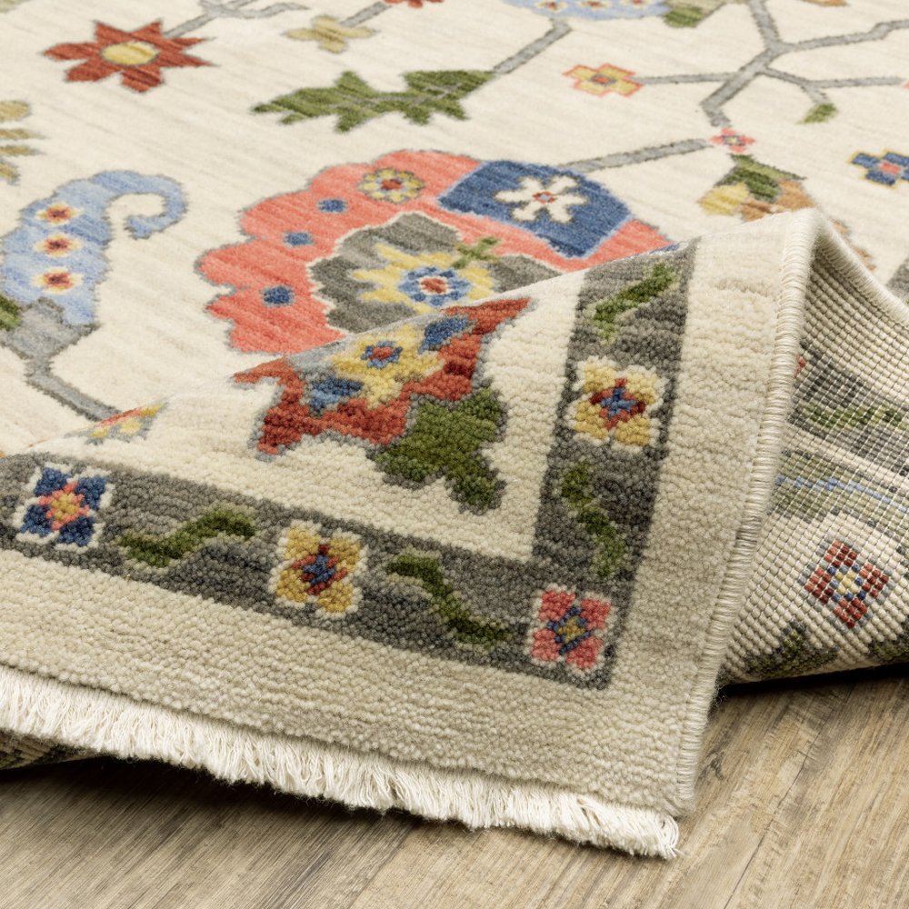 6' X 9' Ivory Green Blues Pink Yellow Rust Brown Tan And Grey Oriental Power Loom Stain Resistant Area Rug With Fringe