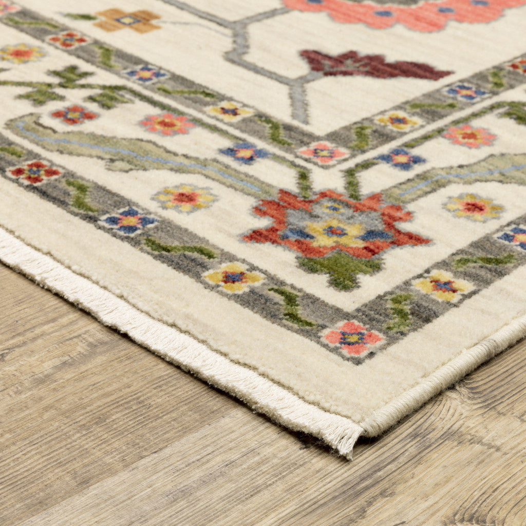 8' X 11' Ivory Green Blues Pink Yellow Rust Brown Tan And Grey Oriental Power Loom Stain Resistant Area Rug With Fringe