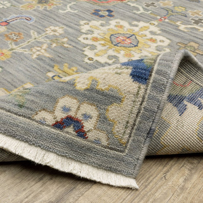 5' X 8' Gray Ivory And Blue Oriental Area Rug With Fringe