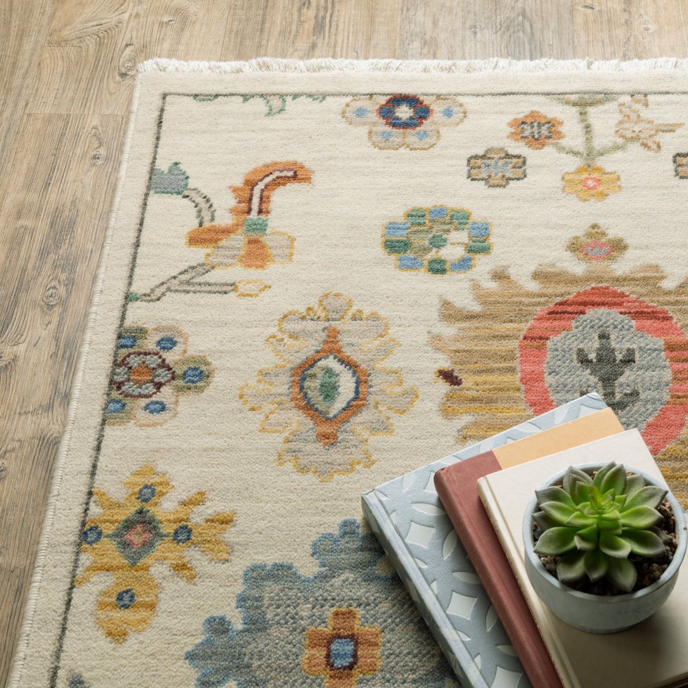 2' x 6' Oriental runner rug in ivory, beige, gold, grey, blue, pink, red, rust and green with fringe; stain resistant, power loom