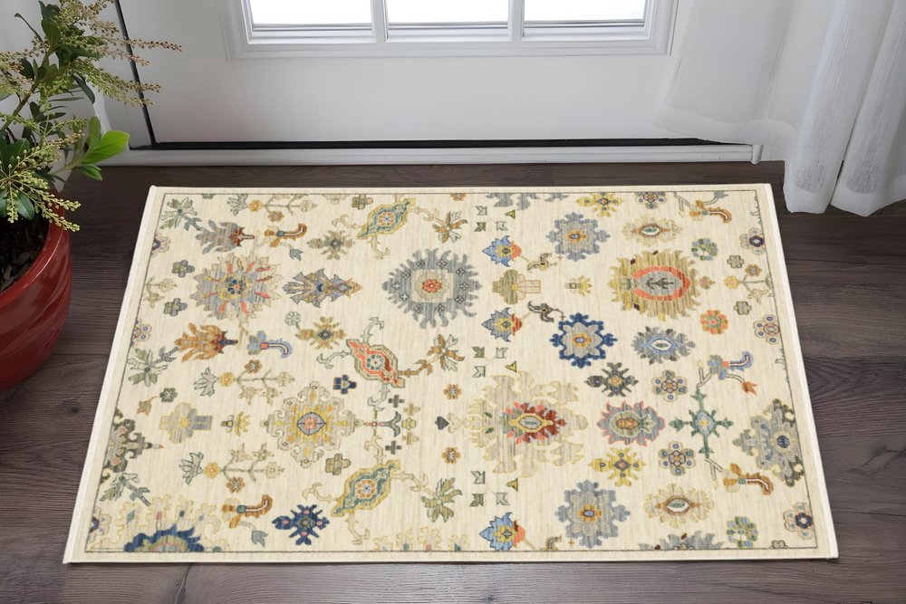 3' X 5' Ivory Beige And Blue Oriental Area Rug With Fringe