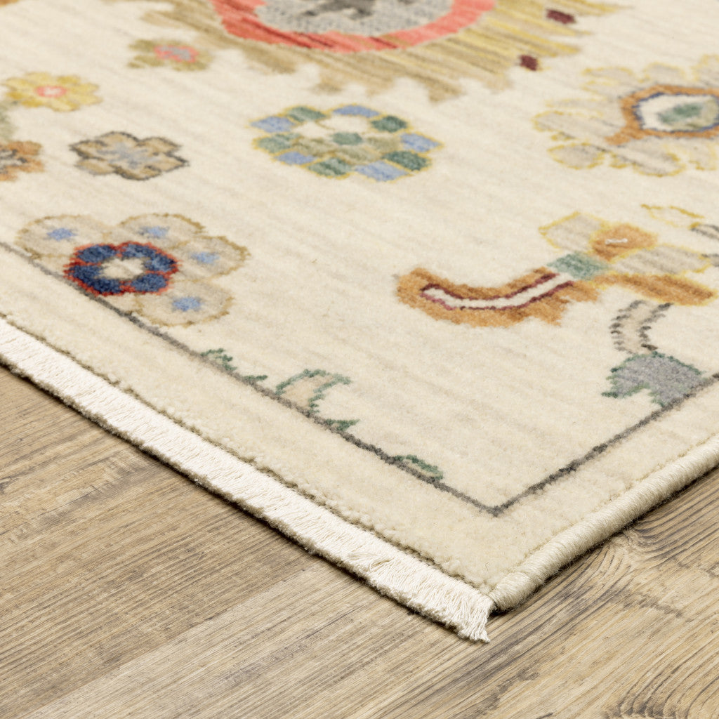 6' X 9' Ivory Beige Gold Grey Blue Pink Red Rust And Green Oriental Power Loom Stain Resistant Area Rug With Fringe