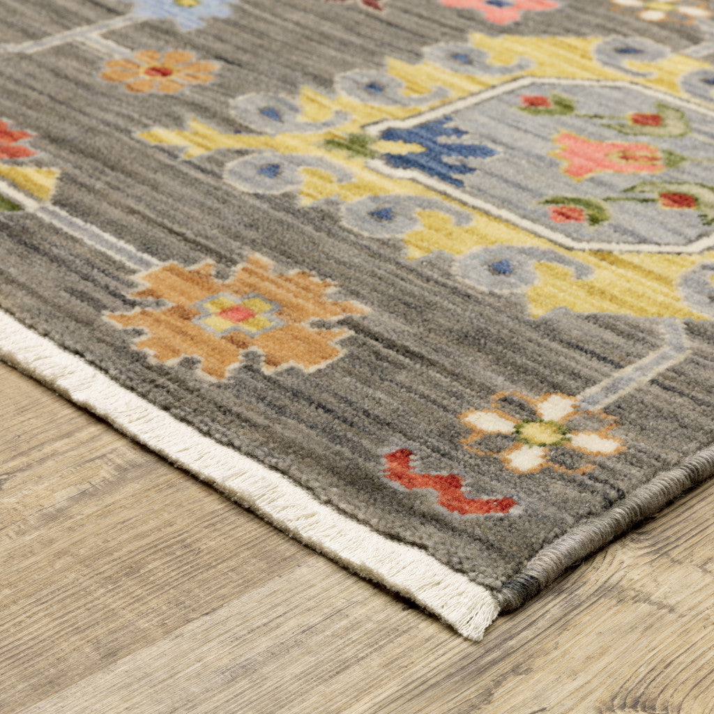 3' X 5' Grey Charcoal Yellow Blue Rust Red Pink Green And Ivory Oriental Power Loom Stain Resistant Area Rug With Fringe