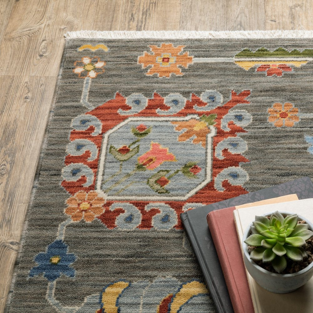 8' X 11' oriental power loom area rug with fringe in grey, charcoal, yellow, blue, rust, red, pink, green & ivory; stain resistant.
