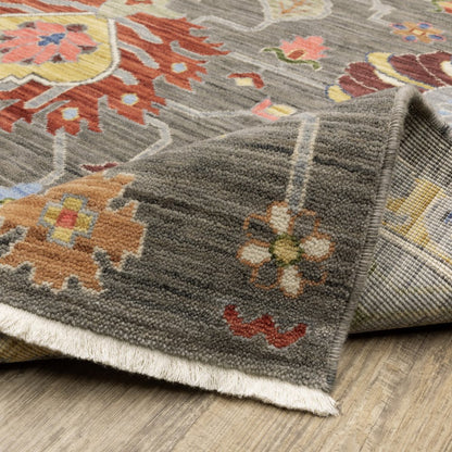 8' X 11' Grey Charcoal Yellow Blue Rust Red Pink Green And Ivory Oriental Power Loom Stain Resistant Area Rug With Fringe