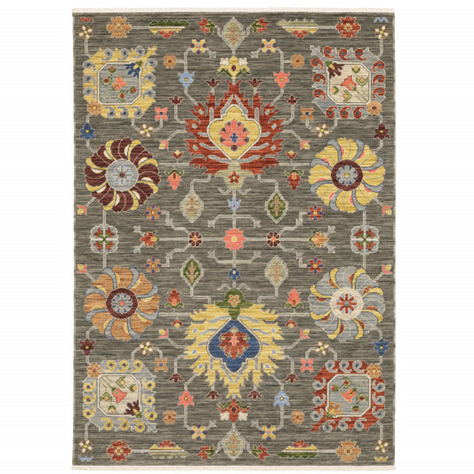 10' X 13' Grey Charcoal Yellow Blue Rust Red Pink Green And Ivory Oriental Power Loom Stain Resistant Area Rug With Fringe