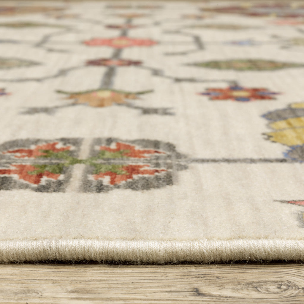 6' X 9' Ivory Yellow Rust Green Grey Pink Orange Blue And Grey Oriental Power Loom Stain Resistant Area Rug With Fringe