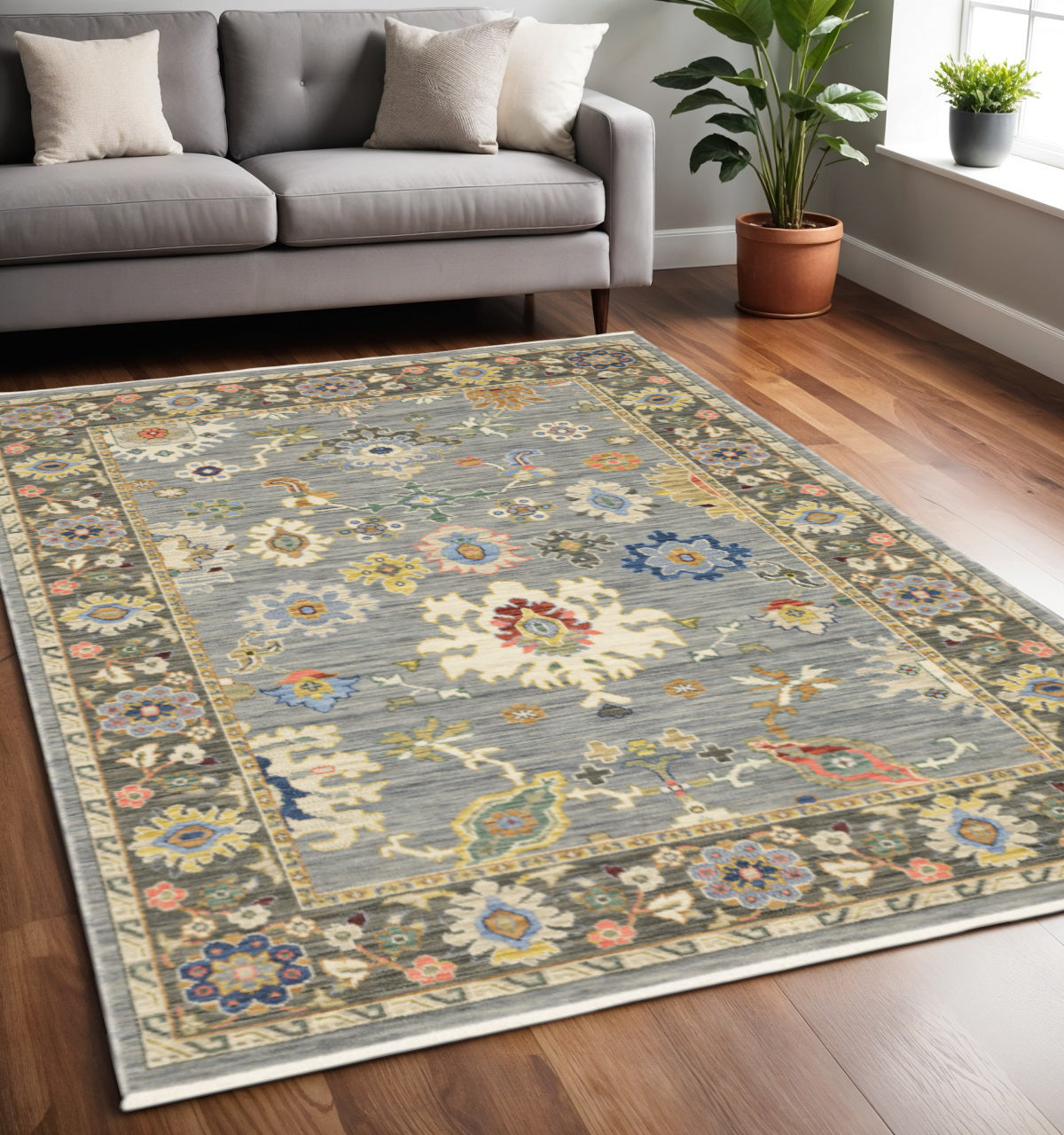 5' X 8' Blue and Ivory Oriental Power Loom Area Rug With Fringe