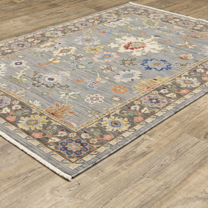 6' X 9' Blue Grey Gold Green Pink Orange Ivory And Red Oriental Power Loom Stain Resistant Area Rug With Fringe