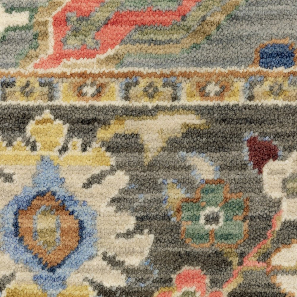 6' X 9' Blue Grey Gold Green Pink Orange Ivory And Red Oriental Power Loom Stain Resistant Area Rug With Fringe