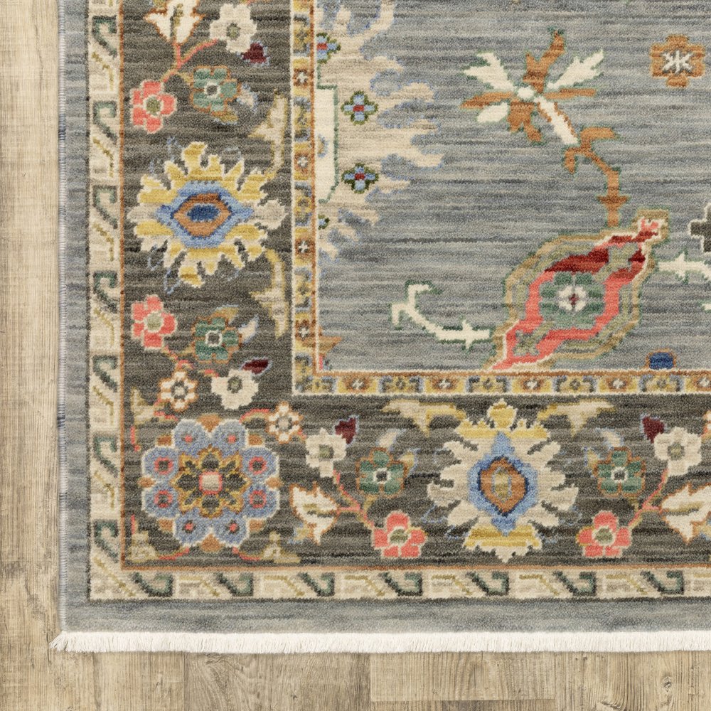 6' X 9' Blue Grey Gold Green Pink Orange Ivory And Red Oriental Power Loom Stain Resistant Area Rug With Fringe