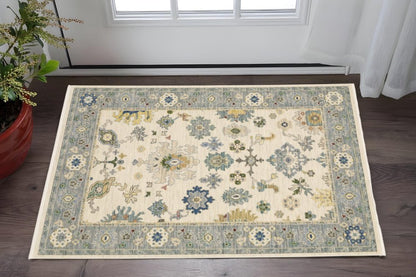 3' X 5' Ivory Blue Grey Teal Gold Green And Rust Oriental Power Loom Stain Resistant Area Rug With Fringe