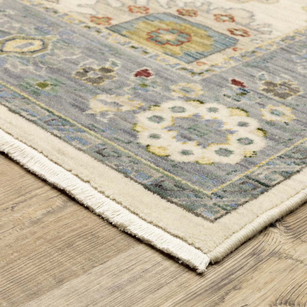 3' X 5' Ivory Blue Grey Teal Gold Green And Rust Oriental Power Loom Stain Resistant Area Rug With Fringe