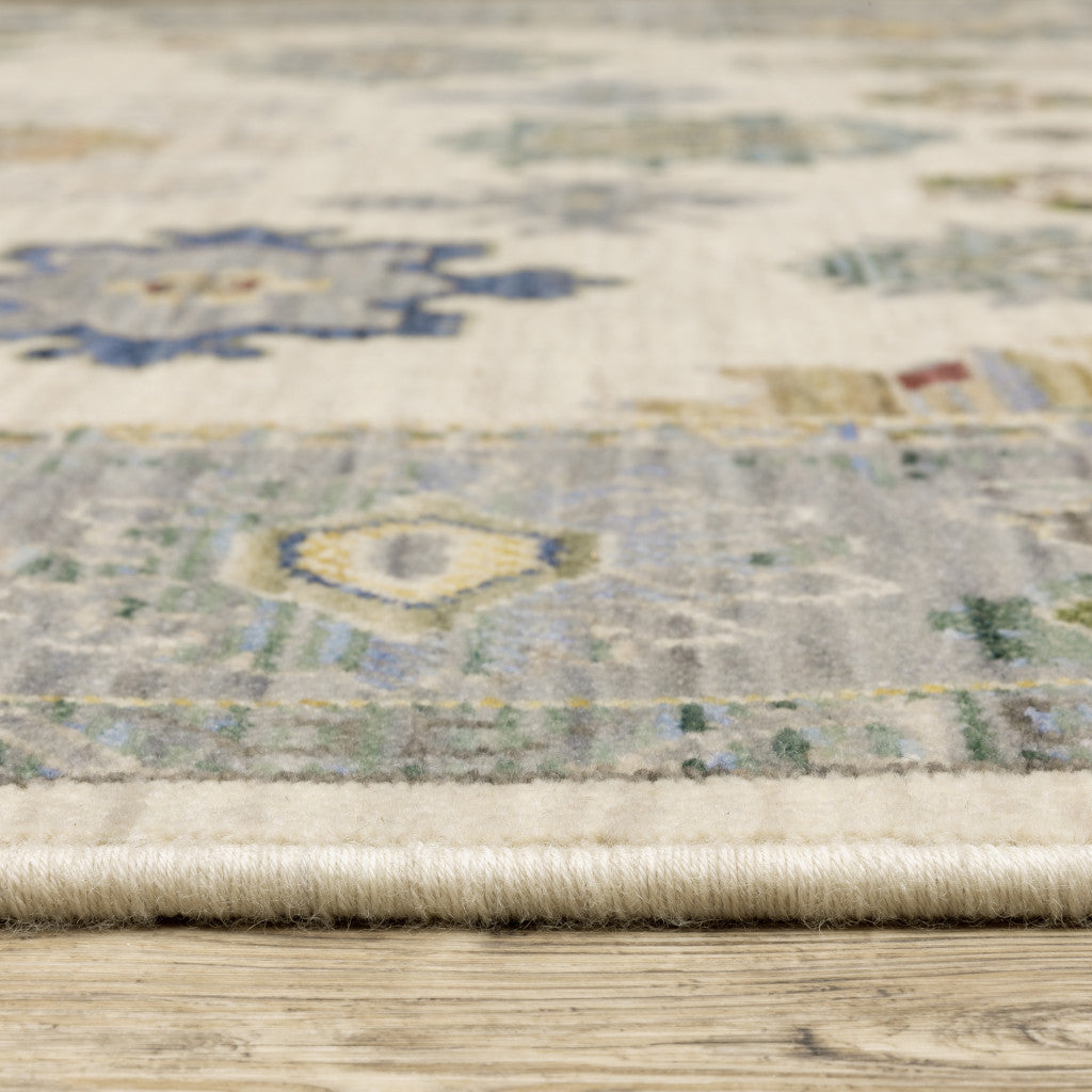 5' X 8' Ivory Blue Grey Teal Gold Green And Rust Oriental Power Loom Stain Resistant Area Rug With Fringe