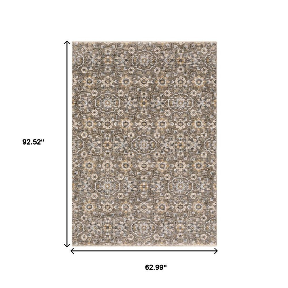 5' X 8' Grey And Tan Floral Power Loom Stain Resistant Area Rug With Fringe