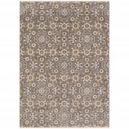 5' X 8' Grey And Tan Floral Power Loom Stain Resistant Area Rug With Fringe