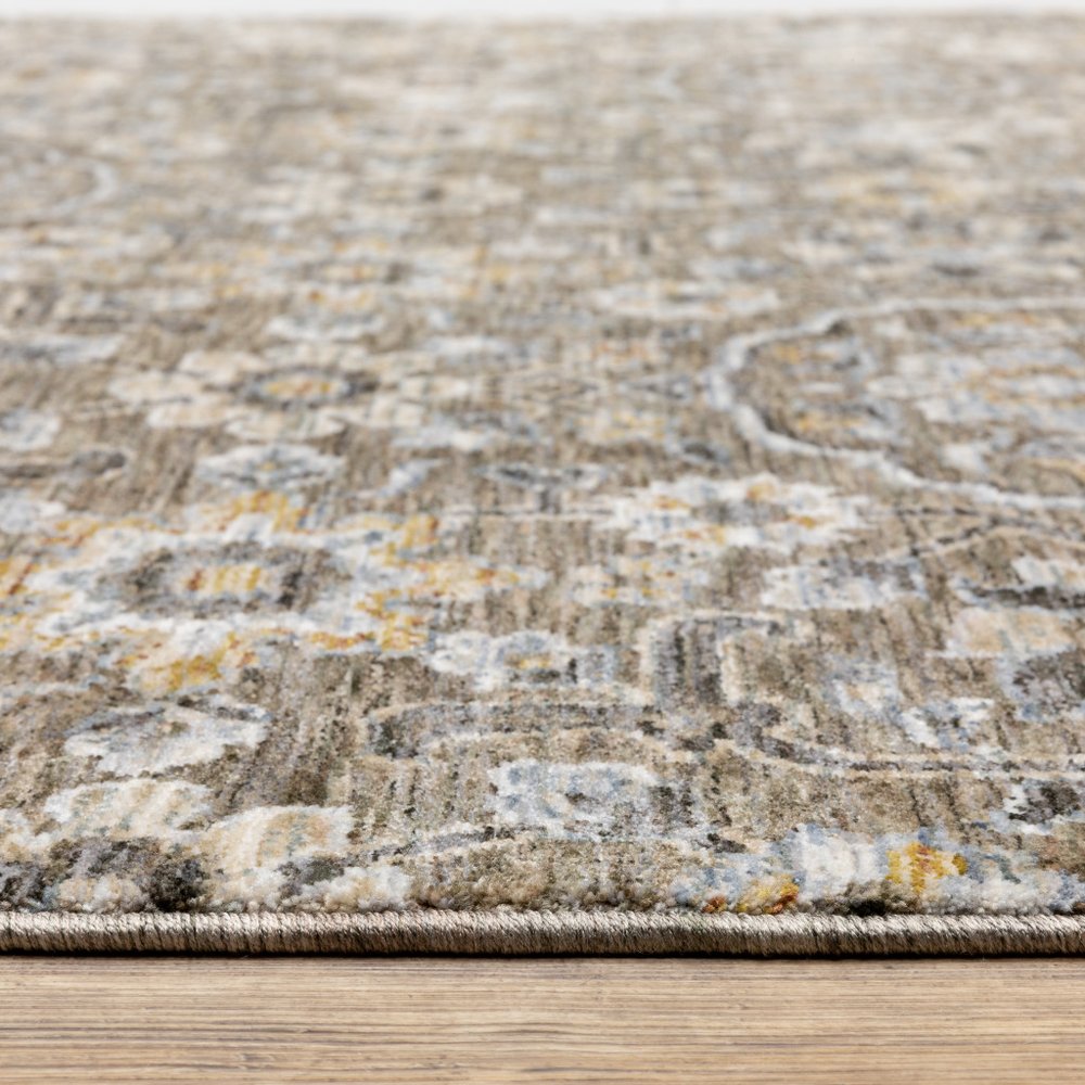 5' X 8' Grey And Tan Floral Power Loom Stain Resistant Area Rug With Fringe