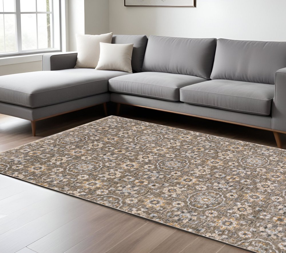 7' X 10' Gray And Gold Floral Area Rug With Fringe
