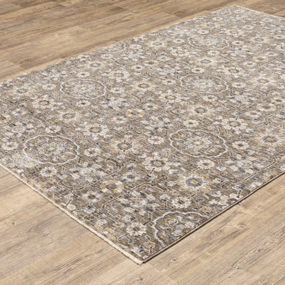 7' X 10' Gray And Gold Floral Area Rug With Fringe