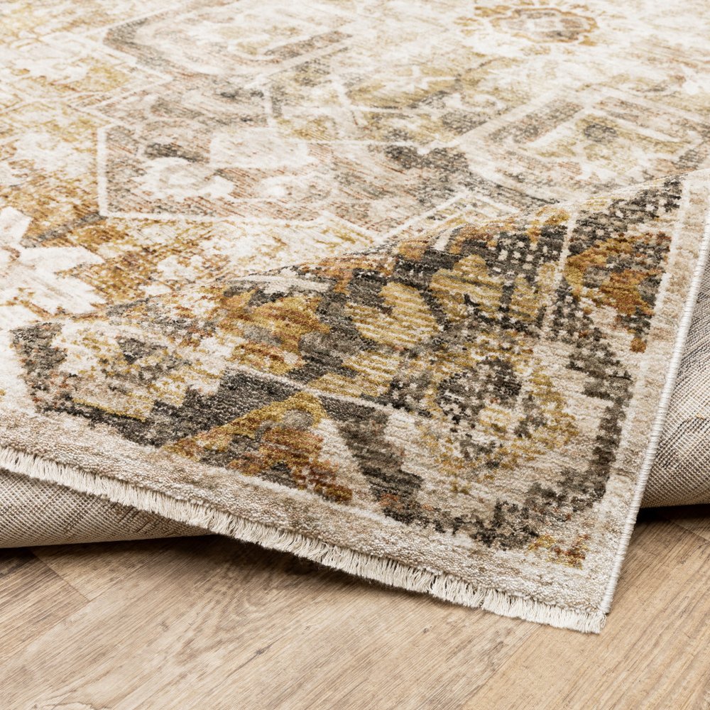 5' X 8' Gold And Ivory Oriental Power Loom Stain Resistant Area Rug With Fringe