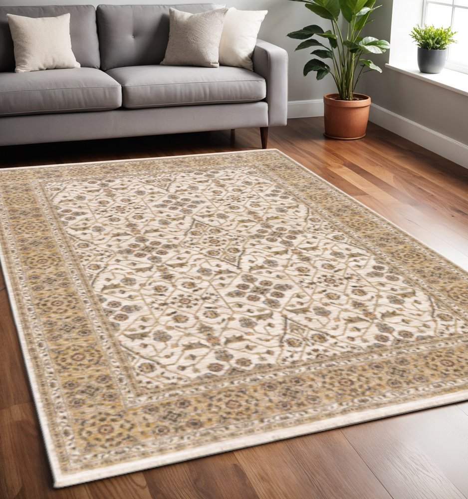 5' X 8' Ivory And Gold Oriental Power Loom Stain Resistant Area Rug With Fringe