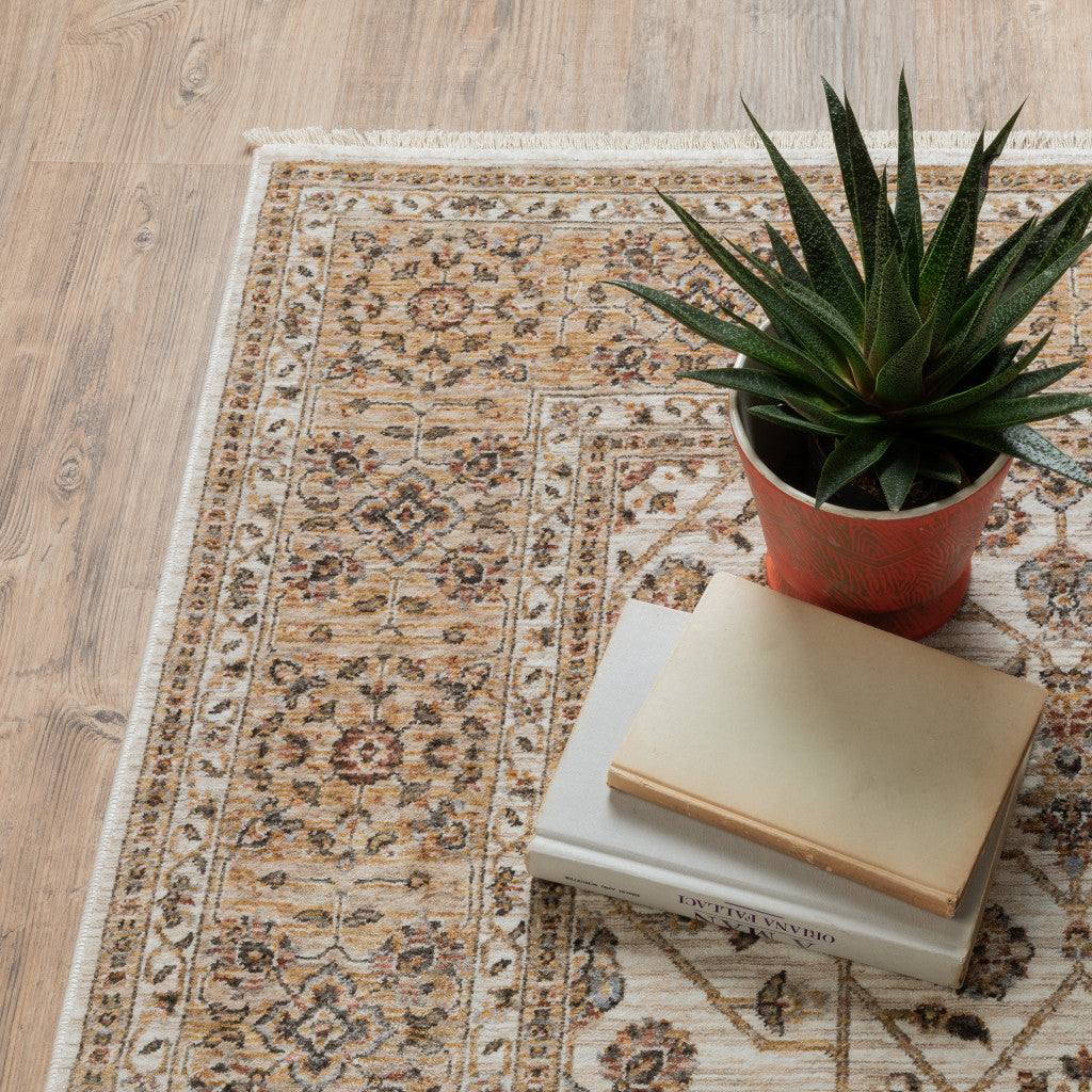 6' X 9' Ivory And Gold Oriental Power Loom Stain Resistant Area Rug With Fringe