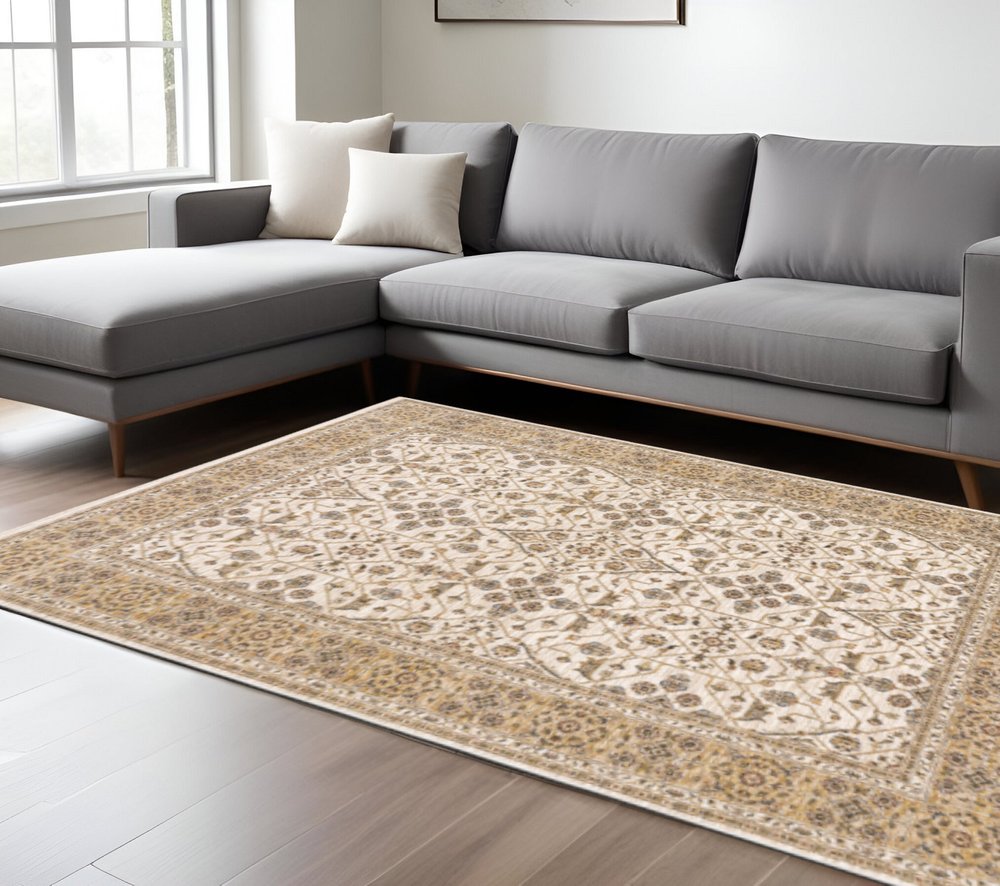 10' X 13' Ivory And Gold Oriental Power Loom Stain Resistant Area Rug With Fringe