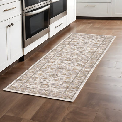 2' X 8' Ivory And Grey Oriental Power Loom Stain Resistant Runner Rug With Fringe