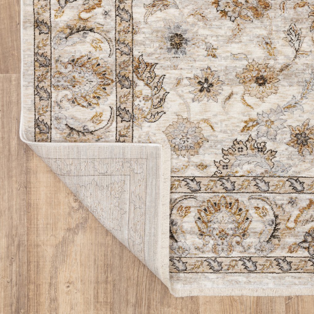 5' X 8' Ivory And Grey Oriental Power Loom Stain Resistant Area Rug With Fringe