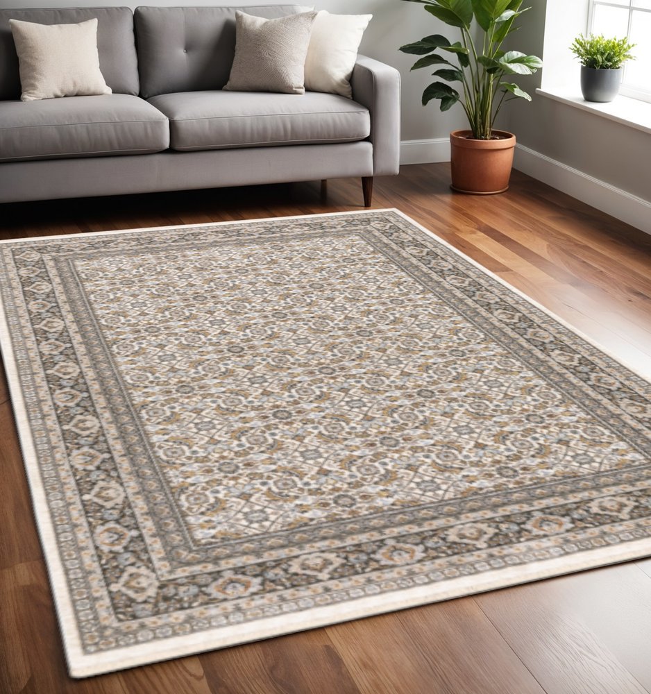 5' X 8' Ivory And Grey Oriental Power Loom Stain Resistant Area Rug With Fringe