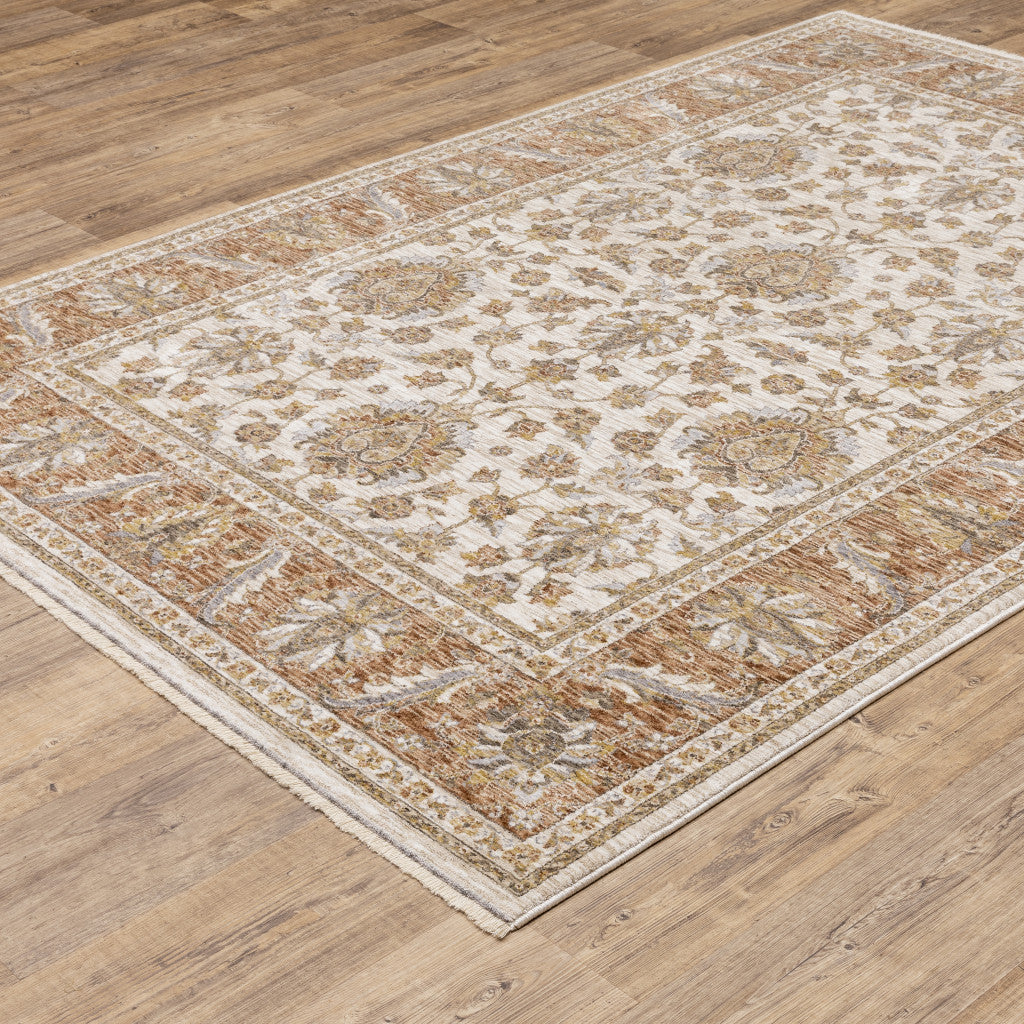 6' X 9' Rust And Ivory Oriental Power Loom Stain Resistant Area Rug With Fringe