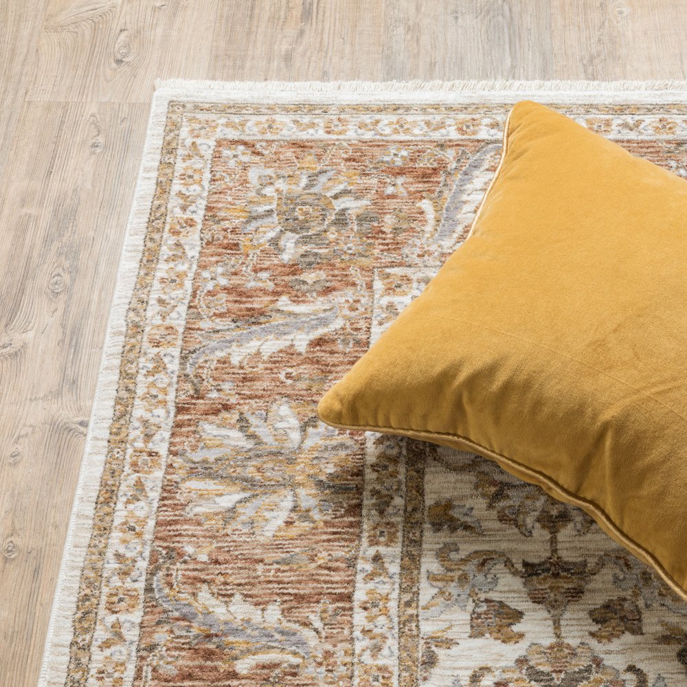 7' X 10' Ivory And Rust Oriental Area Rug With Fringe