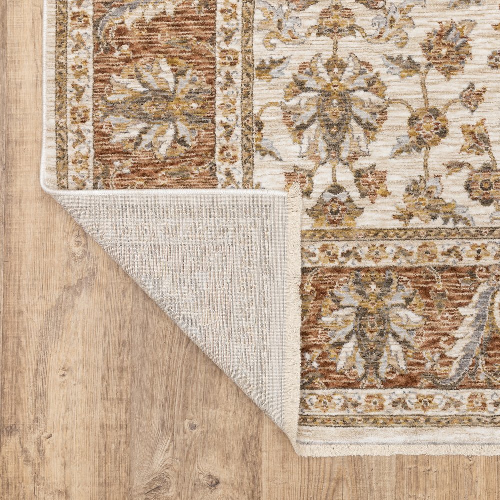 7' X 10' Ivory And Rust Oriental Area Rug With Fringe