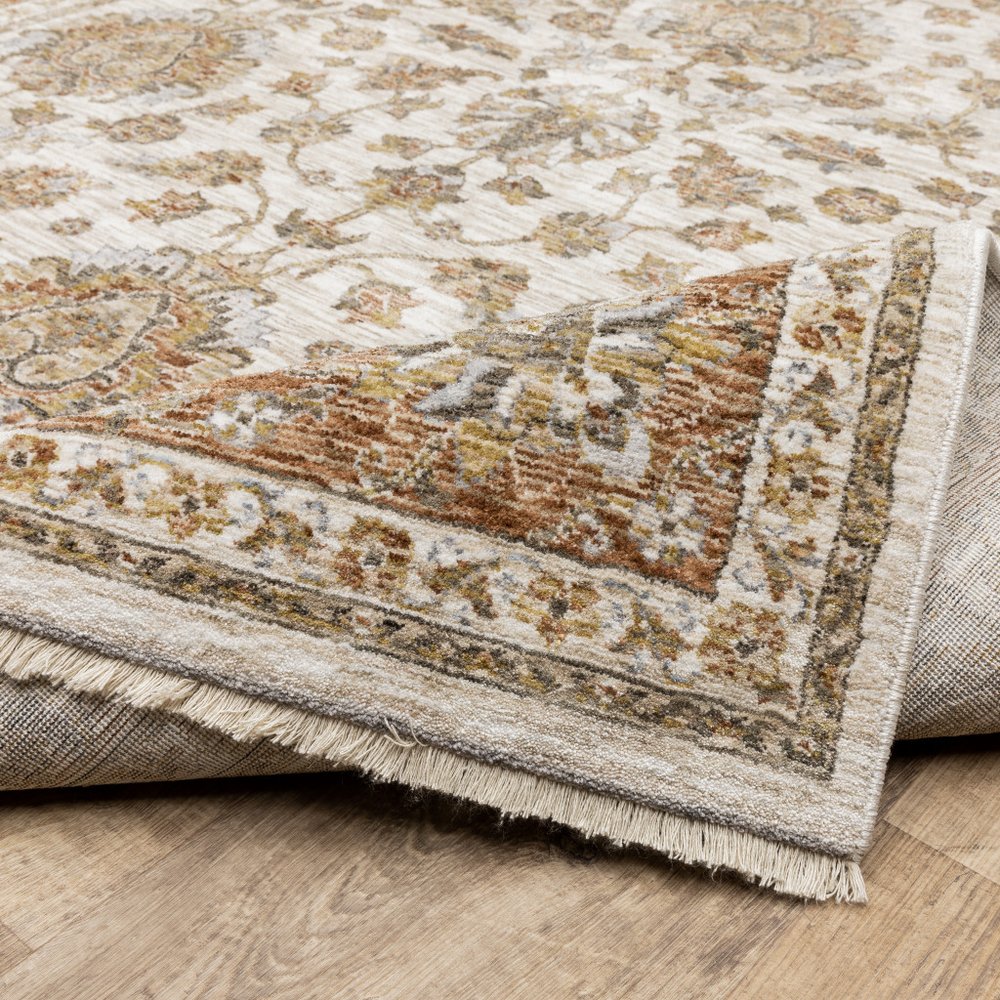 7' X 10' Ivory And Rust Oriental Area Rug With Fringe