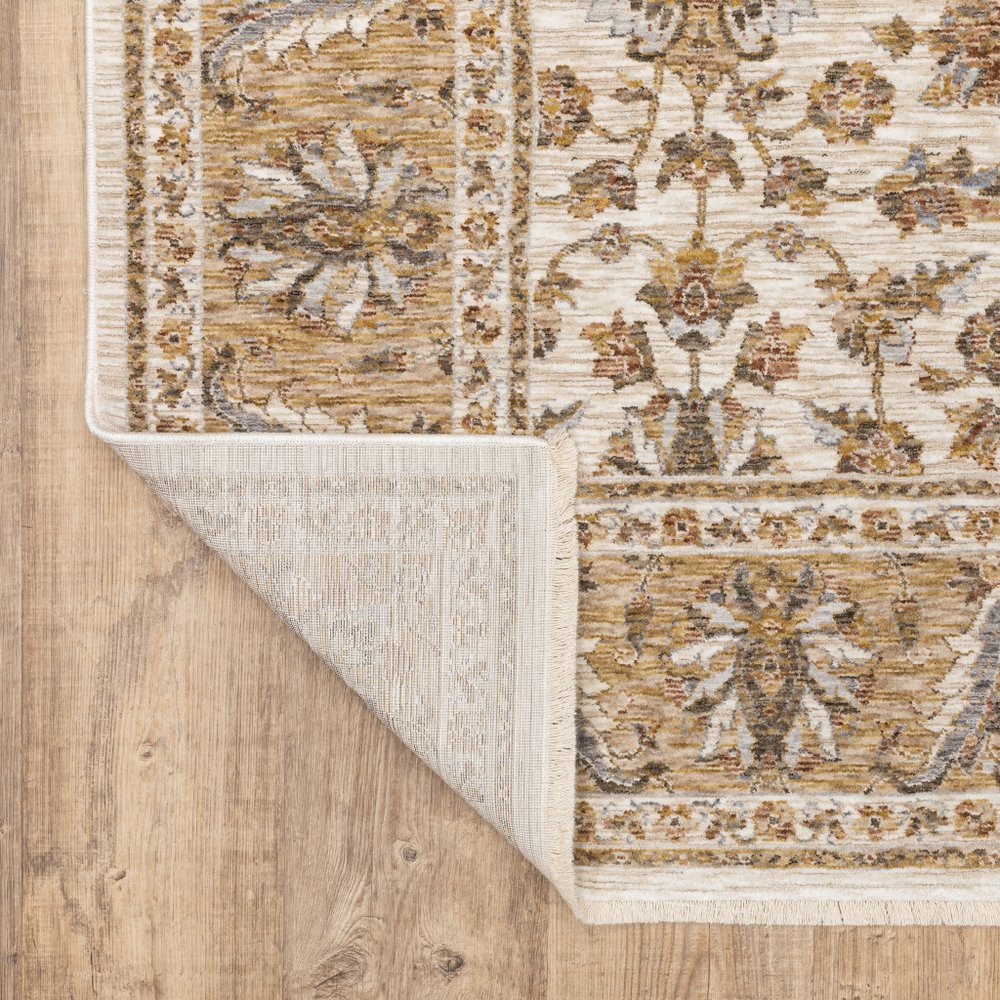 7' X 10' Ivory And Gold Oriental Area Rug With Fringe