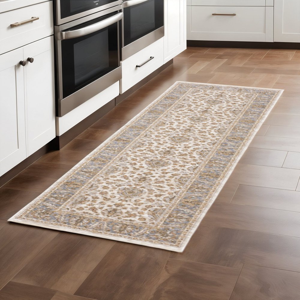 2' X 8' Ivory And Blue Oriental Power Loom Stain Resistant Runner Rug With Fringe