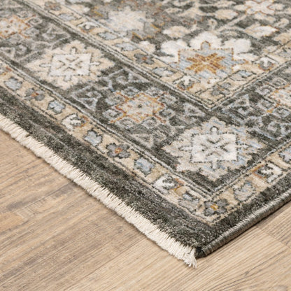 8' X 11' Charcoal Ivory and Beige Floral Power Loom Area Rug With Fringe