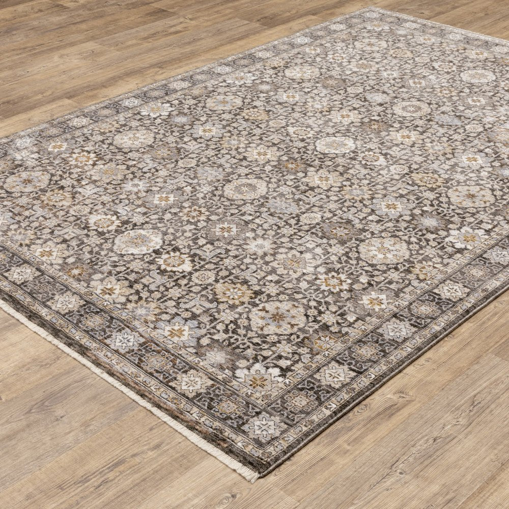 8' X 11' Charcoal Ivory and Beige Floral Power Loom Area Rug With Fringe